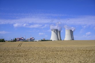 Grain field and cooling towers of the nuclear power plant