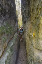 Narrow path through the Skalni mesto Bludiste rock labyrinth