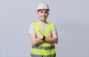 Portrait of smiling handsome engineer on white background