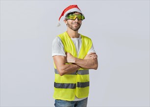 Portrait of a smiling engineer in a christmas hat