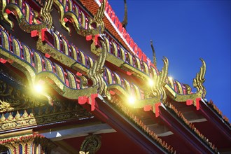 Roof ornaments and pagodas with reflections of the sun