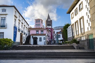 Small square in the old town with colourful houses and chapel Capela de Santo Antonio de Mouraria