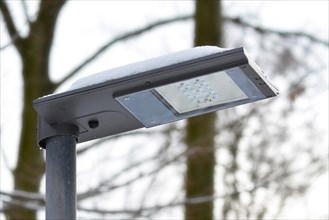 Close up of a solar powered environment friendly LED street light during cloudy weather