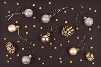 Elegant Christmas flat lay with golden and silver tree ornament baubles