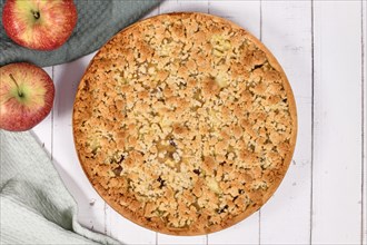 Top view of traditional European apple pie with topping crumbles called 'Streusel'