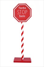 Red Christmas sign with text 'Santa Stop here' on white background