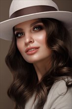 Beautiful sexy woman in a fashionable hat