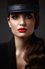 Beautiful sexy woman in a fashionable hat