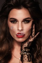 Beautiful sexy brunette girl with bright makeup