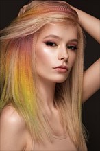 Portrait of beautiful woman with multi-colored hair and classic make up and hairstyle