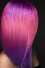 Beautiful woman with multi-colored pink and purple hair