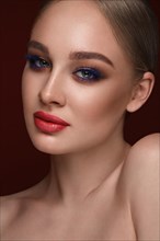 Beautiful girl with bright fashionable make-up. Beauty face. Photo taken in the studio