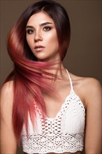 Beautiful pink-haired girl in move with a perfectly smooth hair