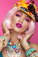 Funny comic girl with bright make-up in the style of pop art. Creative image. Beauty face. Photo taken in the studio