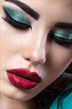 Beautiful brunette girl with arabic evening make-up and perfect skin. Beauty face. Close up