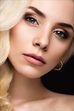 Beautiful blond woman with evening make-up