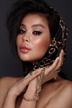 Beautiful Asian brunette model with volume curls