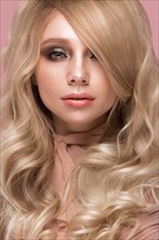Beautiful blond girl with curls hair