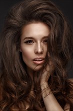 Beautiful brunette model with volume curls