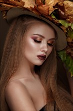 Beautiful blond model autumn hat with curls