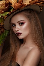Beautiful blond model autumn hat with curls