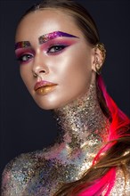 Beautiful girl with creative glitter makeup with sparkles