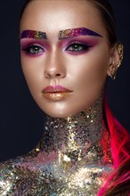 Beautiful girl with creative glitter makeup with sparkles