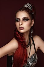 Portrait of a beautiful woman in a disco style image with creative makeup and hairstyle