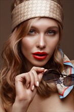Beautiful girl in stylish clothes with sunglasses and red sexy lips. Beauty face. Photo taken in the studio