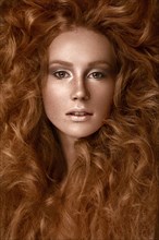 Beautiful Redhead girl with a perfectly creative curls hair and classic make-up
