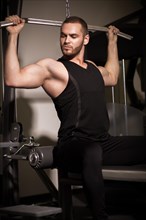 Sporty sexy men with great abdominal muscles in black sportswear