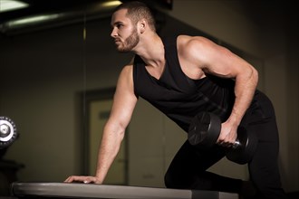 Sporty sexy men with great abdominal muscles in black sportswear