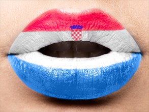 Female lips close up with a picture of the flag of Croatia. white