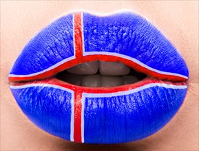Female lips close up with a picture of the flag of Iceland. Blue