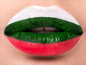Female lips close up with a picture of the flag of Bulgaria. white