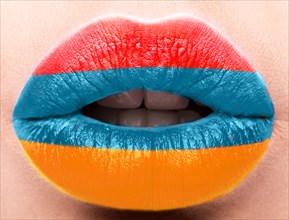 Female lips close up with a picture of the flag of Armenia. Blue