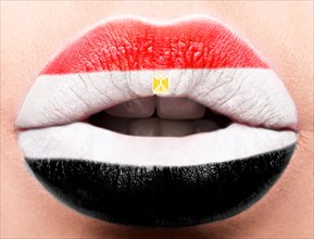 Female lips close up with a picture of the flag of Egypt. white