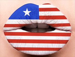 Female lips close up with a picture of the flag of Liberia. white