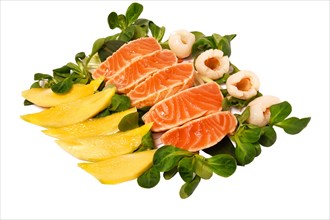 Assorted raw salmon with greens and mango isolate on a white plate. Japanese restaurant menu
