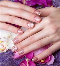 Snow White manicure on female hands. Winter nail design. Picture taken in the studio