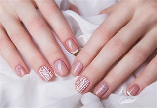 Snow White manicure on female hands. Winter nail design. Picture taken in the studio