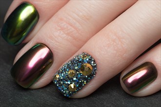 Beautifil Colorful manicure with rhinestone. Nail Design. Close-up