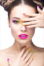 Beautiful girl in pink sunglasses with bright makeup and colorful nails. Beauty face. Picture taken in the studio on a white background