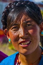 Friendly tibetan woman in the town of Ali