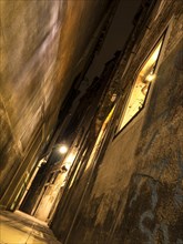Narrow alley with lantern in Venice