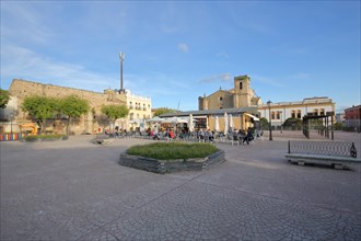 Square with street bar and church Iglesia de la Encarnacion and school Colegio Maria de la Paz Orellana