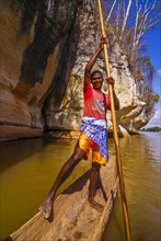 Boy padddling on the Tsiribina river