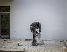 Construction worker working with an angle grinder