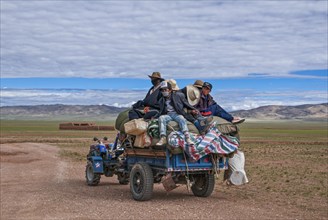 Tibetan pilgrims on a tractor on the road from Gerze to Tsochen