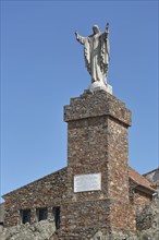 Statue with Jesus on Stone
